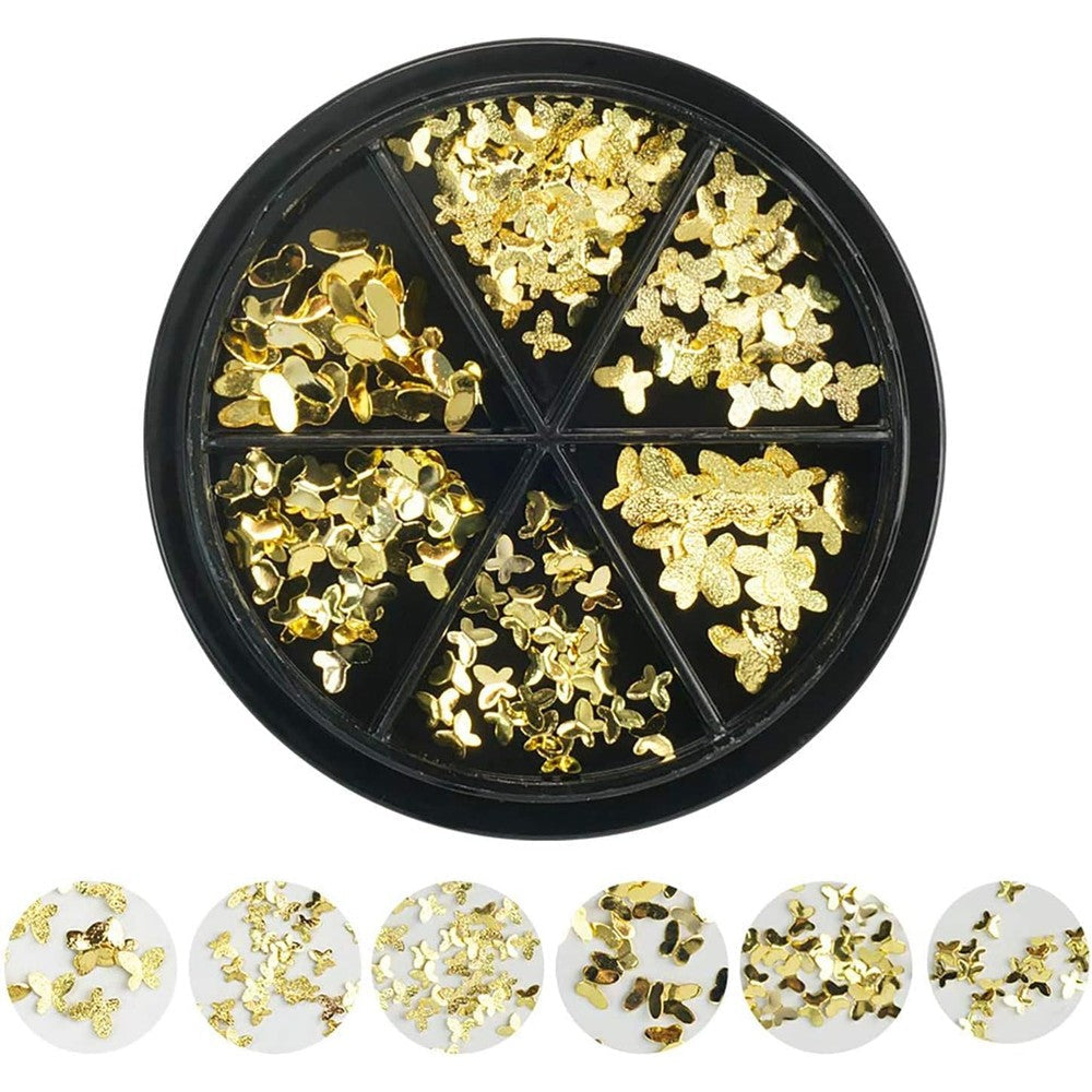 DSHIJIE gold butterfly nail art charms front view displayed on professional manicured acrylic nails.
