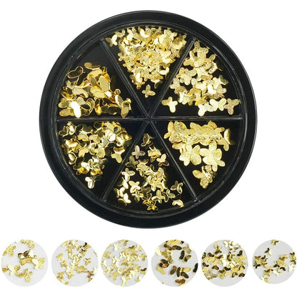 DSHIJIE gold butterfly nail art charms front view displayed on professional manicured acrylic nails.