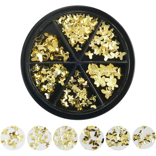 DSHIJIE gold butterfly nail art charms front view displayed on professional manicured acrylic nails.