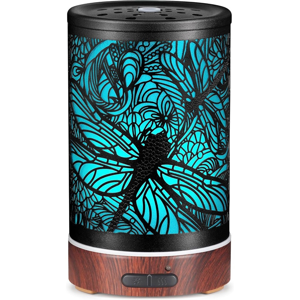 Kobodon dragonfly metal essential oil diffuser front view on wood table.