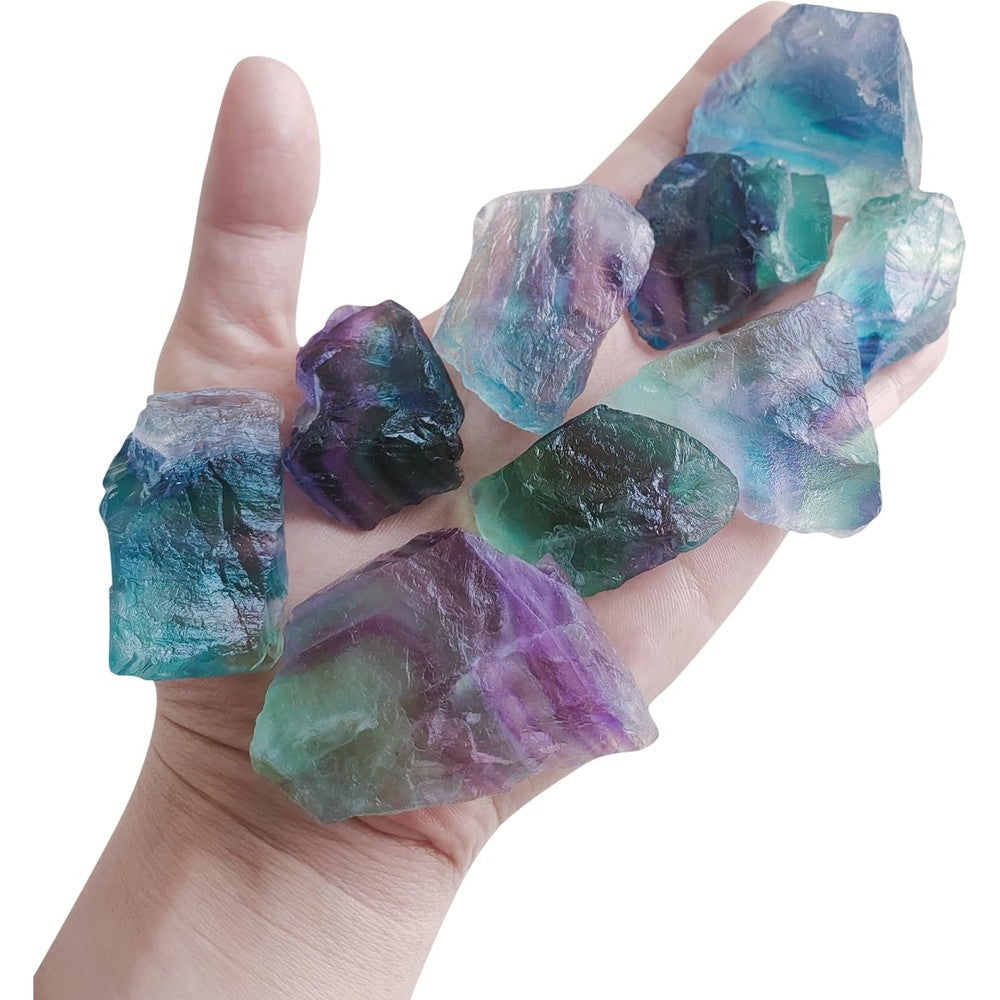 Luckeeper Rough Crystals Bulk Raw Healing Stones front view featuring a handful of colorful rainbow fluorite rocks.