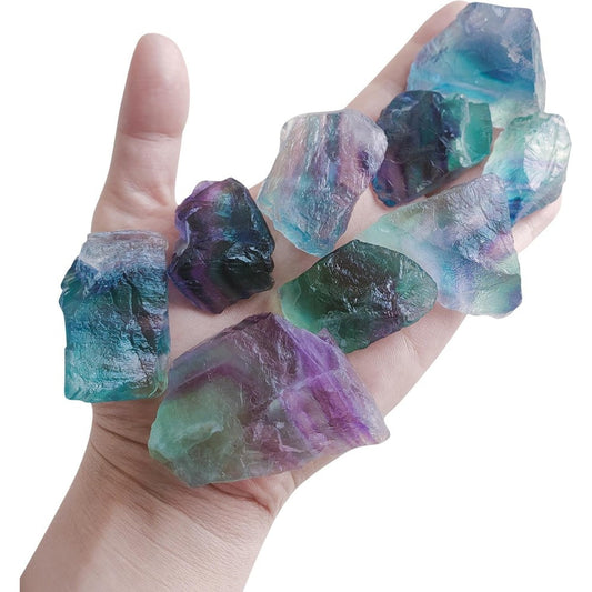 Luckeeper Rough Crystals Bulk Raw Healing Stones front view featuring a handful of colorful rainbow fluorite rocks.