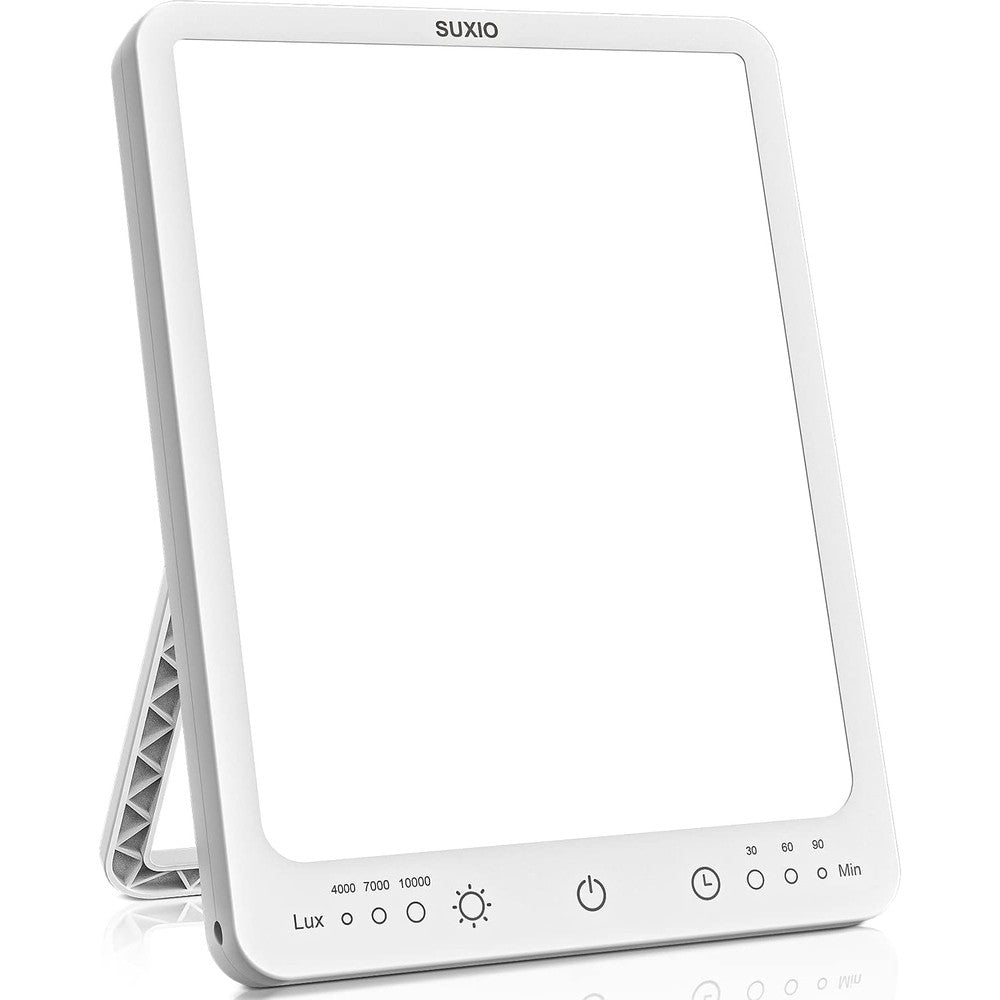 SUXIO Light Therapy Lamp front view on an office desk displaying bright white light.