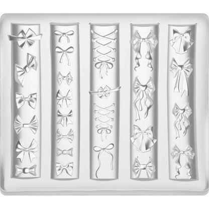 Thrymme bow nail mold front view showing transparent 3D silicone cavities for professional nail art accessories.