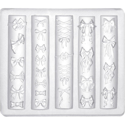 Lasuroa bow nail charm mold front view showing multiple transparent 3D bow design cavities.