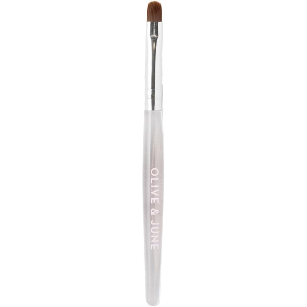 Olive and June Clean Up Brush front view showcasing the sleek handle and rounded flexible tip design.
