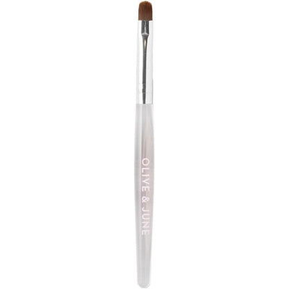 Olive and June Clean Up Brush front view showcasing the sleek handle and rounded flexible tip design.