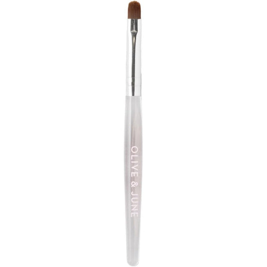Olive and June Clean Up Brush front view showcasing the sleek handle and rounded flexible tip design.