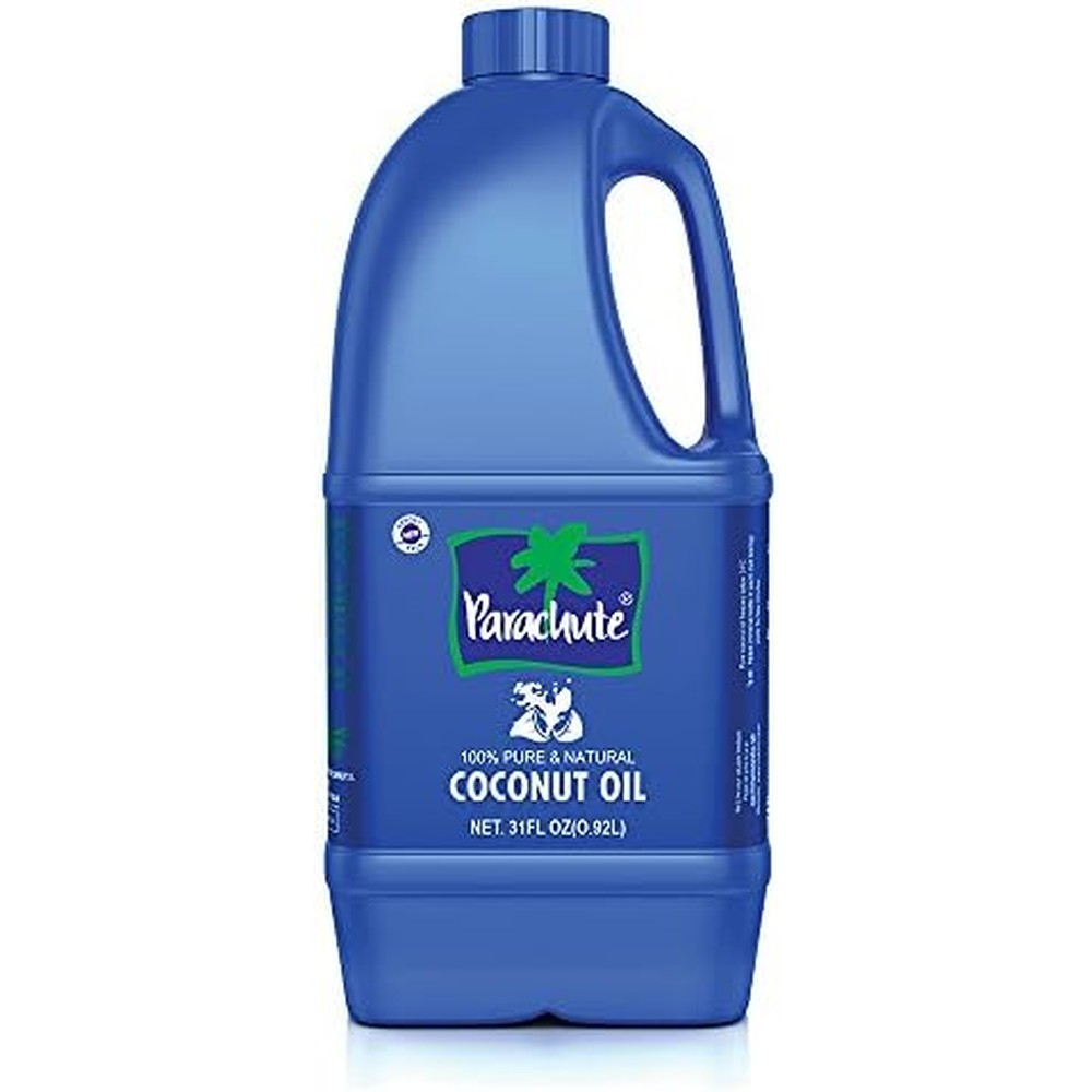 Parachute unrefined coconut oil 31 fluid ounce front view bottle for deep hair nourishment