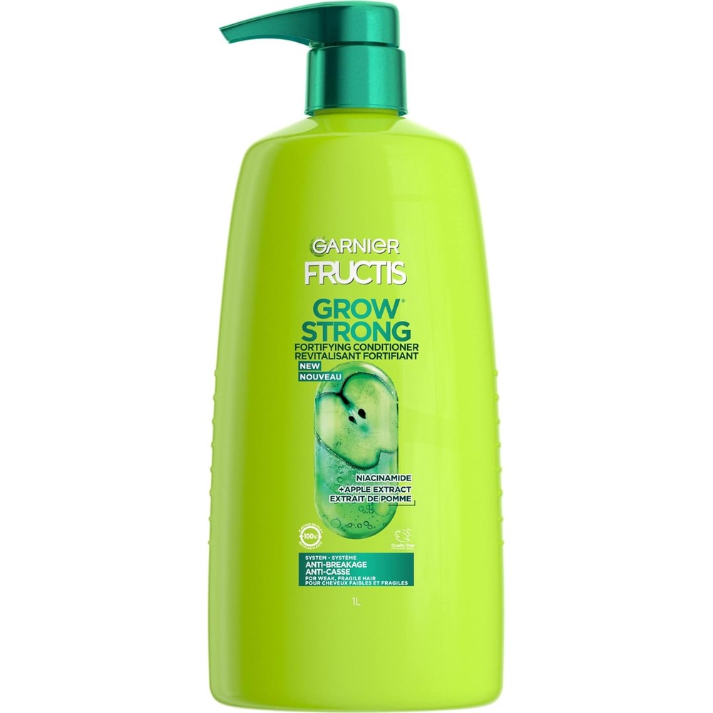 Garnier Fructis Grow Strong Fortifying Conditioner front view in 33.8 Fluid Ounce bottle.