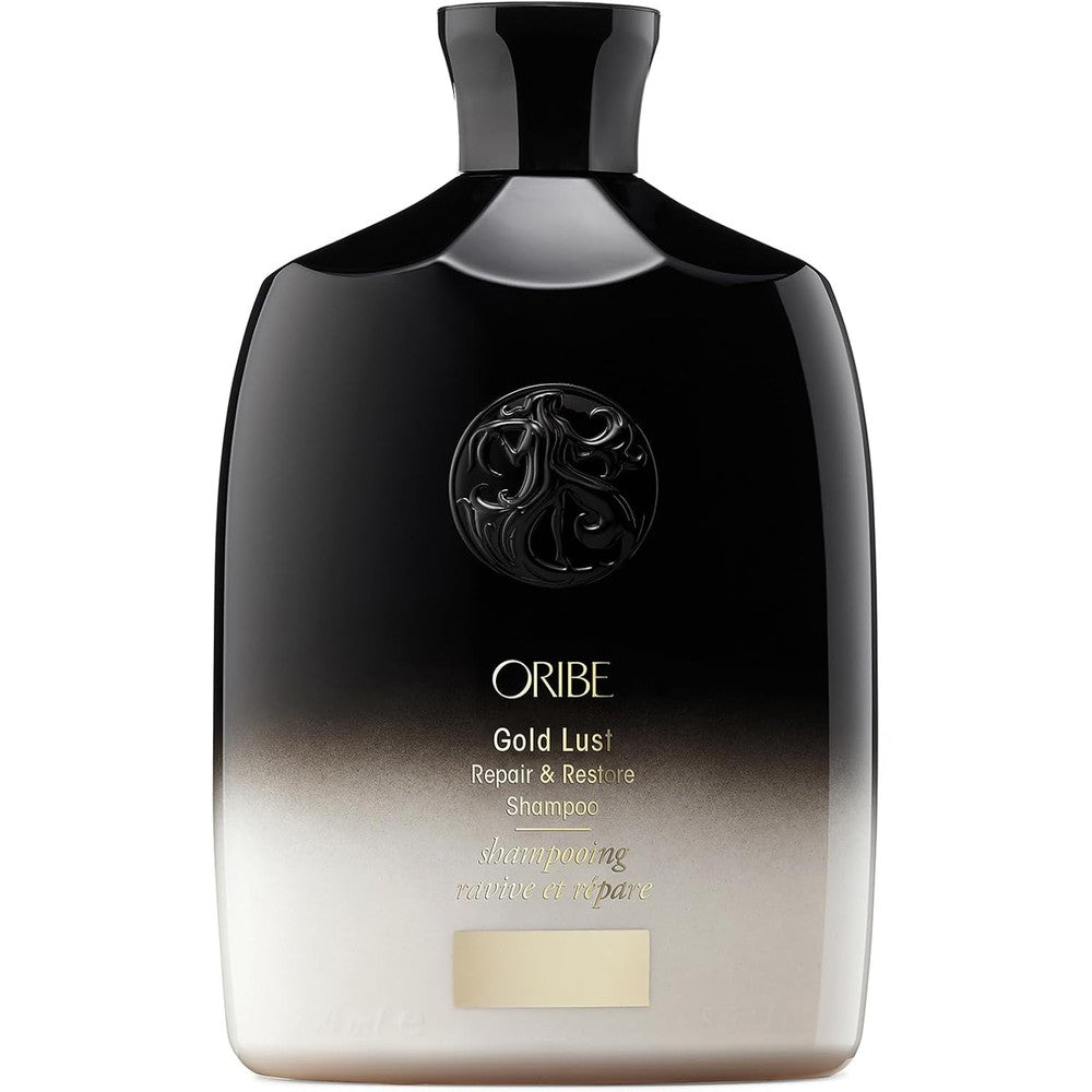 Oribe Gold Lust Repair And Restore Shampoo front view bottle showing premium gradient design for damaged hair care.