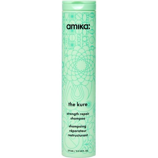 Amika The Kure Strength Repair Shampoo front view of light green bottle for damaged hair care.