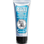 Reuzel Matte Styling Paste front view of the blue tube featuring a barbershop chair graphic
