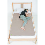 PeapodMats Waterproof Bedwetting Bed Mat in Sand front view showing premium texture