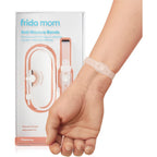 Frida Mom Nausea Bands front view of the packaging and two peach-colored wristbands.