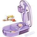ColeMela pill cutter splitter front view showing the purple exterior and compact design.
