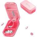 Hafigigi Pill Cutter Splitter pink variant front view showing safety lock mechanism.