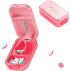 Hafigigi Pill Cutter Splitter pink variant front view showing safety lock mechanism.