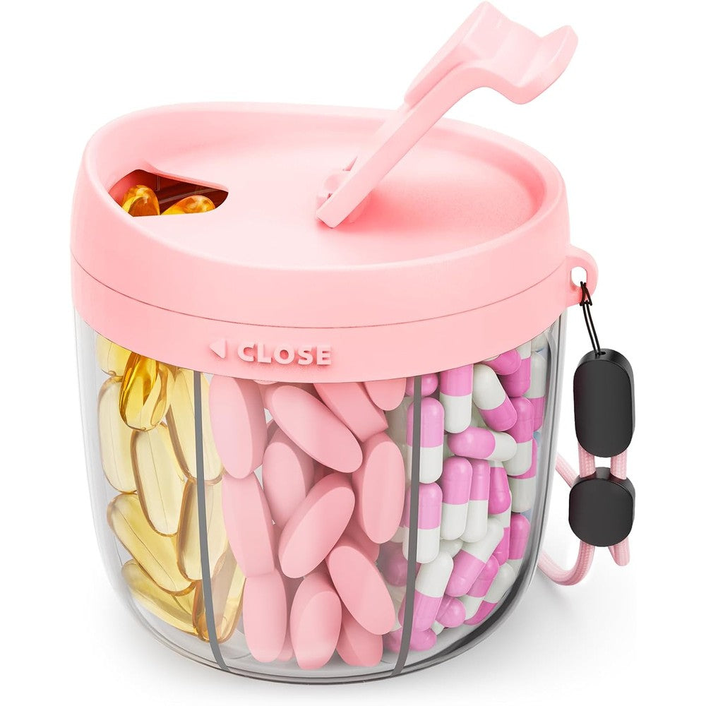 AMOOS Cute Pill Dispenser front view showcasing the pink rotating swivel lid and clear seven compartment base.