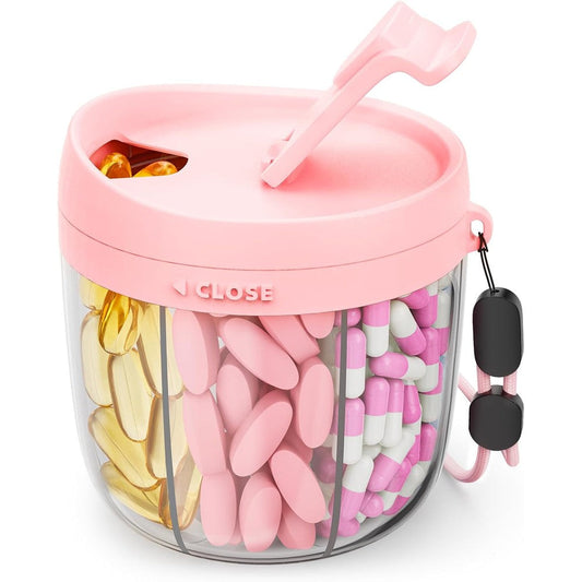 AMOOS Cute Pill Dispenser front view showcasing the pink rotating swivel lid and clear seven compartment base.