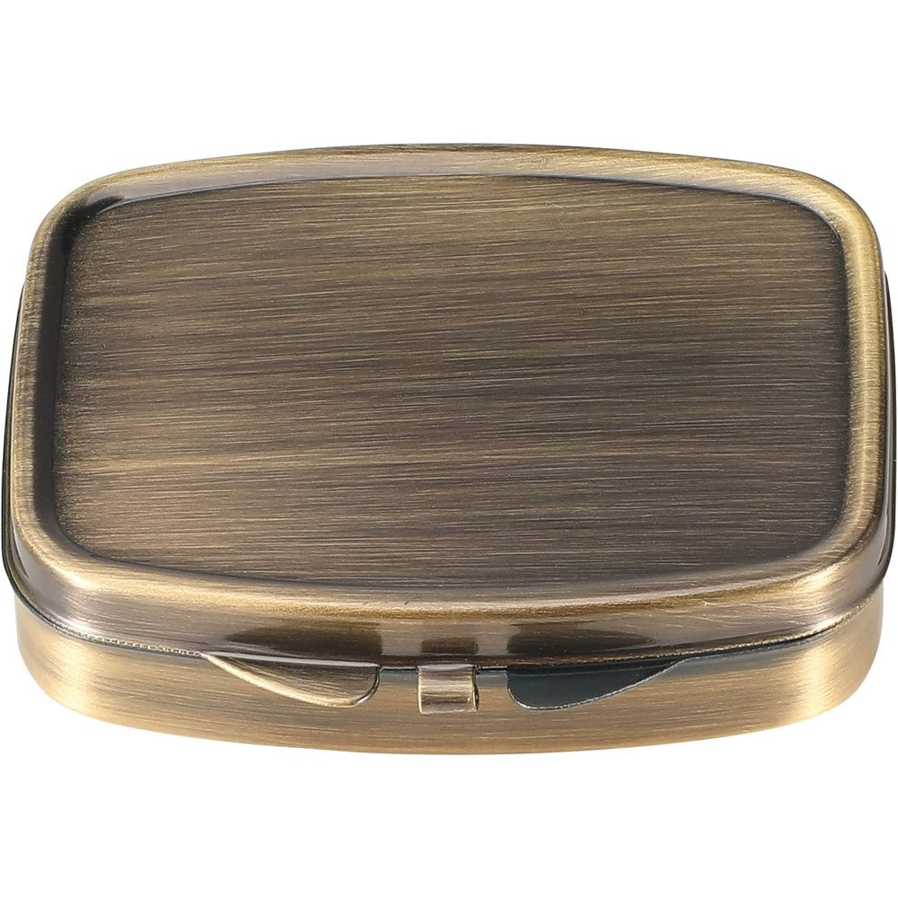 Dynippy Retro Pill Case front view showcasing antique metal finish and secure lock closure.