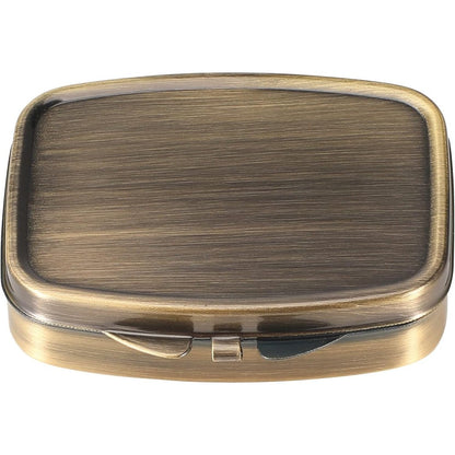 Dynippy Retro Pill Case front view showcasing antique metal finish and secure lock closure.