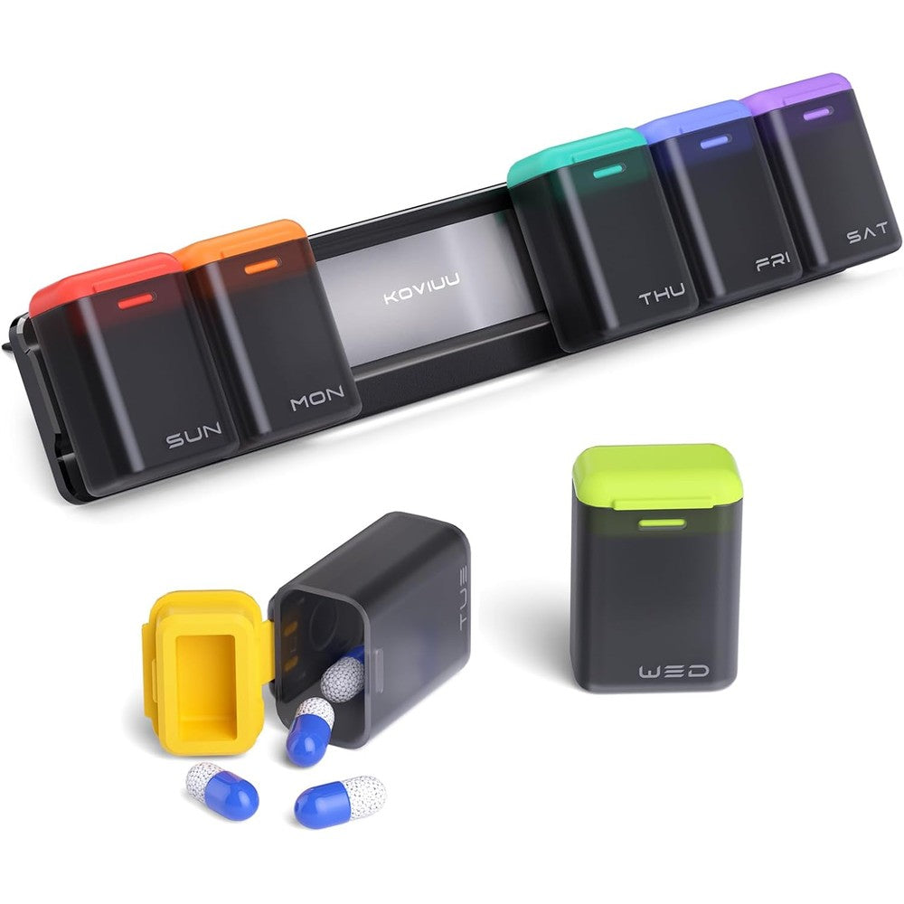 KOVIUU weekly pill organizer magnetic black front view attached to a refrigerator.