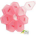 Zuiaso 7-Day Weekly Pill Organizer front view showing the pinkish-red round design and labeled days of the week