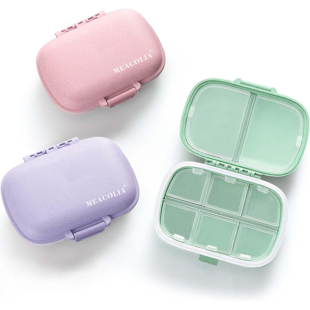 Meacolia 3 pack travel pill organizer front view showing purple green and pink compact medicine cases
