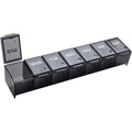 Ezy Dose Weekly 7 Day Daily Pill Case front view showing seven clearly labeled black daily compartments for medicine organization.