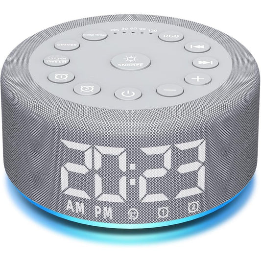 Hushing sound machine alarm clock front view displaying the digital time screen and top control buttons.