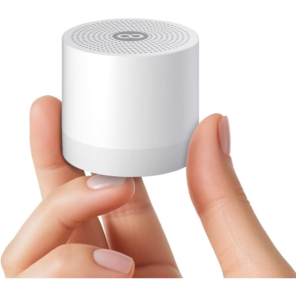 Hushing white noise machine mini portable design front view on a bedside table