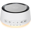 SoundMe White Noise Machine front view with warm yellow night light glow.
