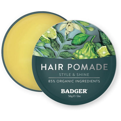 Badger Man Care Hair Pomade two ounce tin front view showing certified organic grooming packaging.
