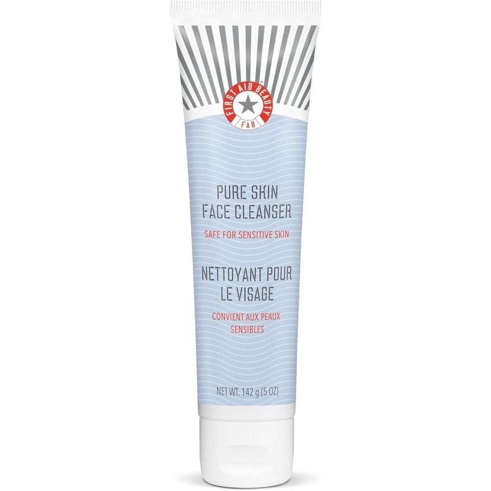 First Aid Beauty Pure Skin Face Cleanser front view tube on premium background