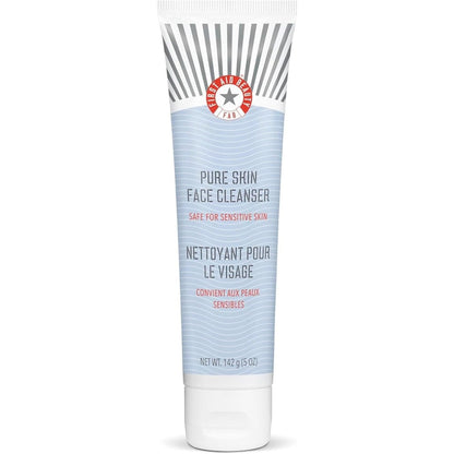 First Aid Beauty Pure Skin Face Cleanser front view tube on premium background