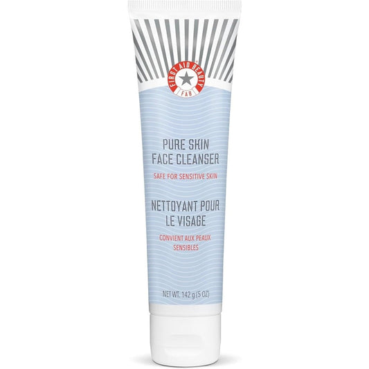 First Aid Beauty Pure Skin Face Cleanser front view tube on premium background