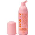 Curacoro Eyelash Extension Cleanser front view showing pink pump bottle packaging.