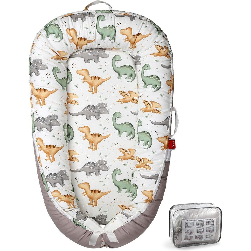 Butoa breathable soft baby nest lounger front view showcasing dinosaur print