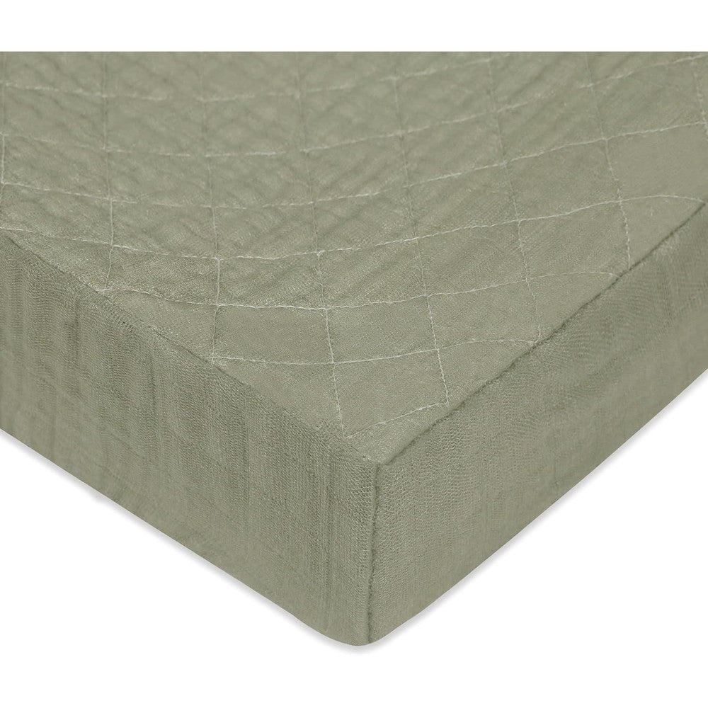 Babyletto quilted organic cotton changing pad cover front view in matcha green
