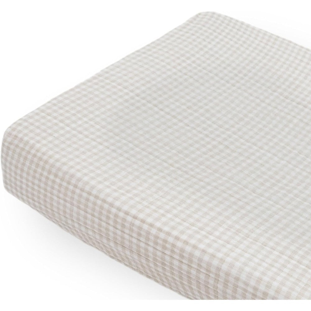 Little Unicorn cotton muslin changing pad cover front view in tan gingham pattern for nursery setup.