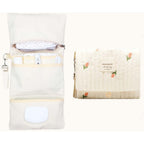 Modakids baby bag organizer front view showcasing quilted floral print and travel design