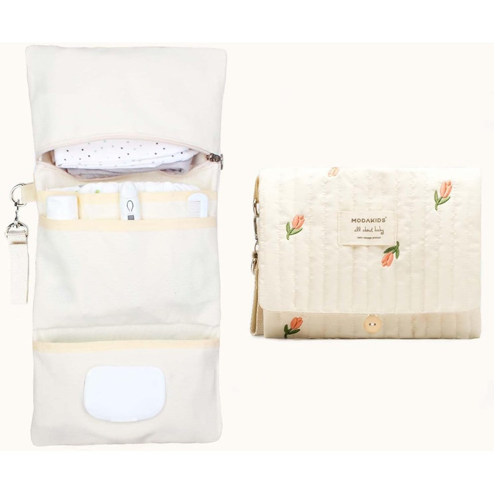 Modakids baby bag organizer front view showcasing quilted floral print and travel design