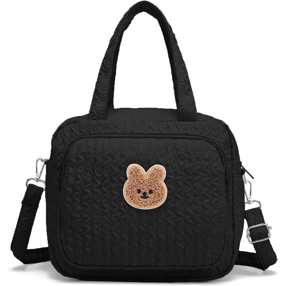Fwkekye small diaper bag tote front view showcasing black quilted nylon and bear patch.