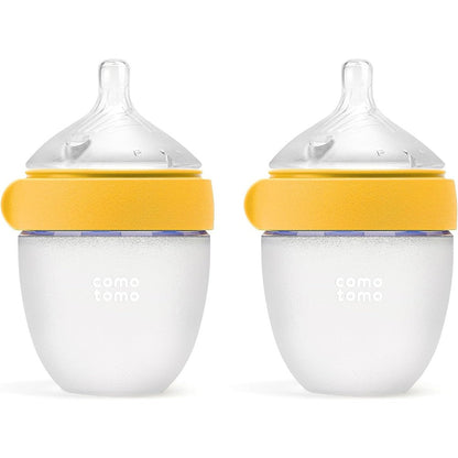 Comotomo Silicone Baby Bottle Gen 2 yellow twin pack front view showing naturally shaped newborn nipples.