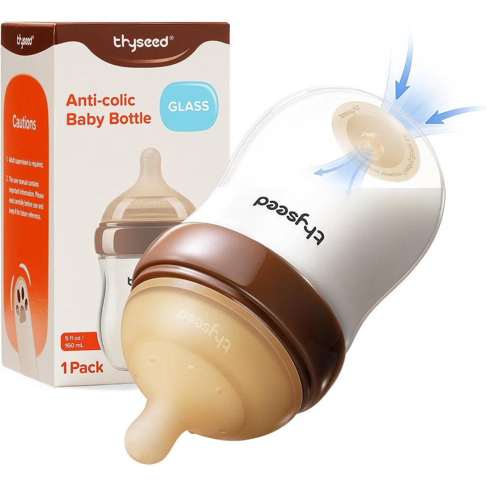 Thyseed anti colic glass baby bottle front view showing breast like silicone nipple