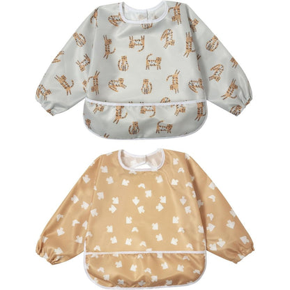 Little Dimsum Baby Bib Pack front view showing the waterproof long sleeve design and flip-out food catcher pocket.