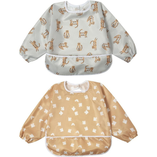Little Dimsum Baby Bib Pack front view showing the waterproof long sleeve design and flip-out food catcher pocket.