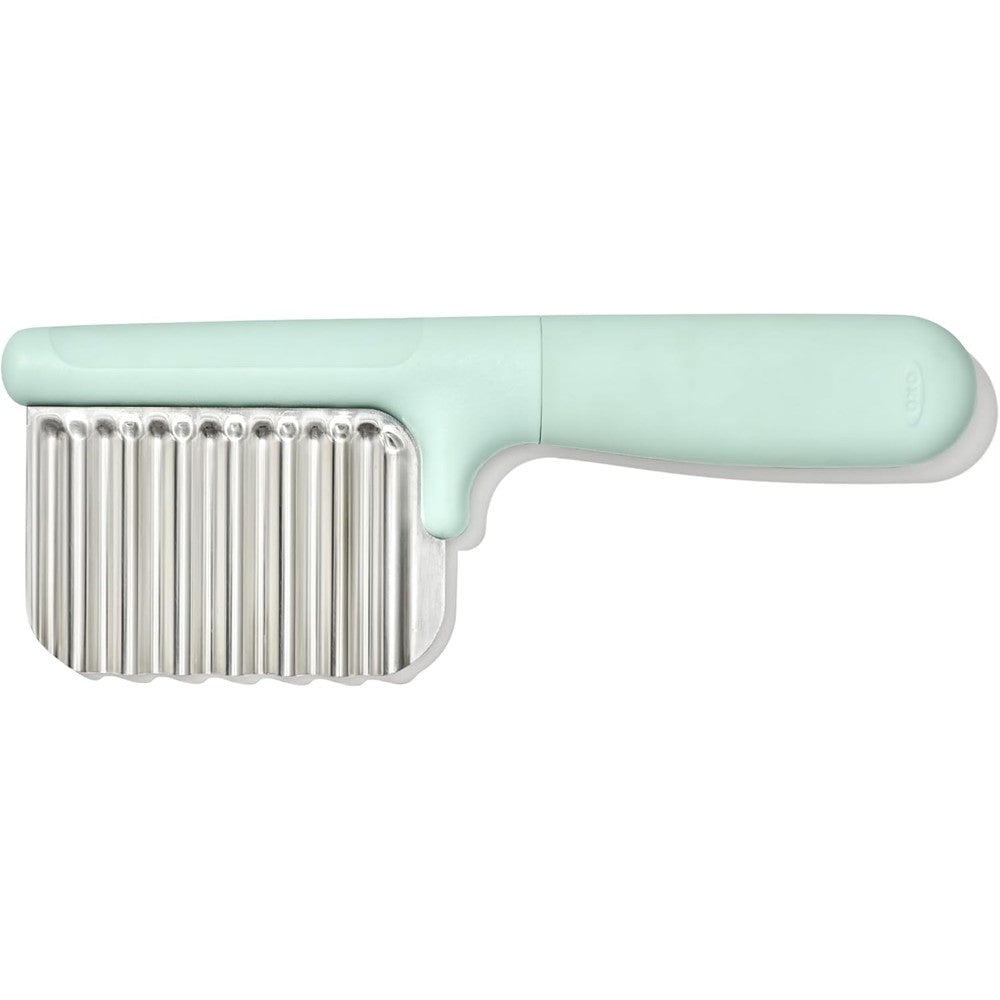 OXO Tot Crinkle Cutter front view showing mint green handle and stainless steel wavy blade