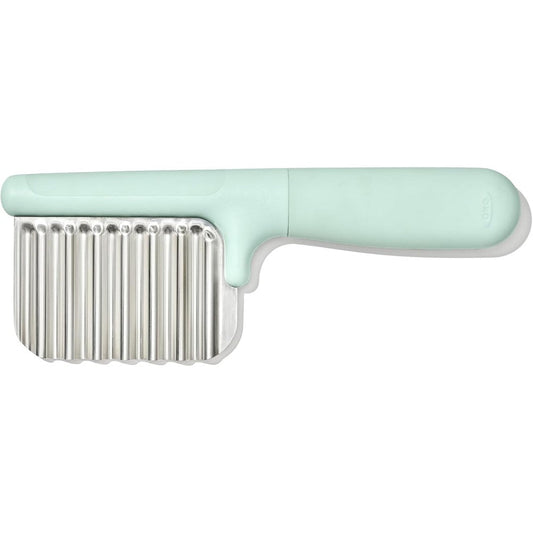 OXO Tot Crinkle Cutter front view showing mint green handle and stainless steel wavy blade